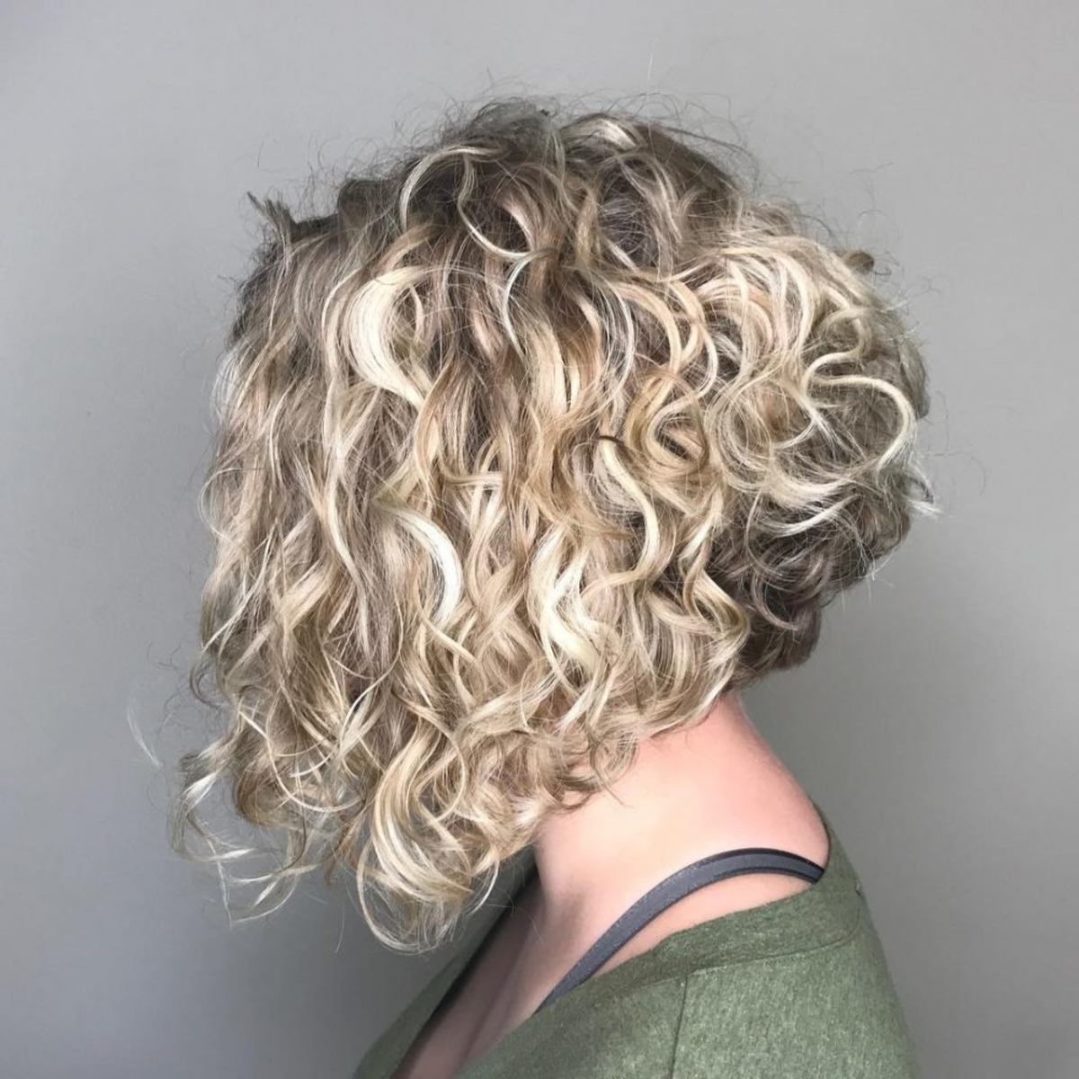 A-line Curly Bob Cut with Blonde Streaks