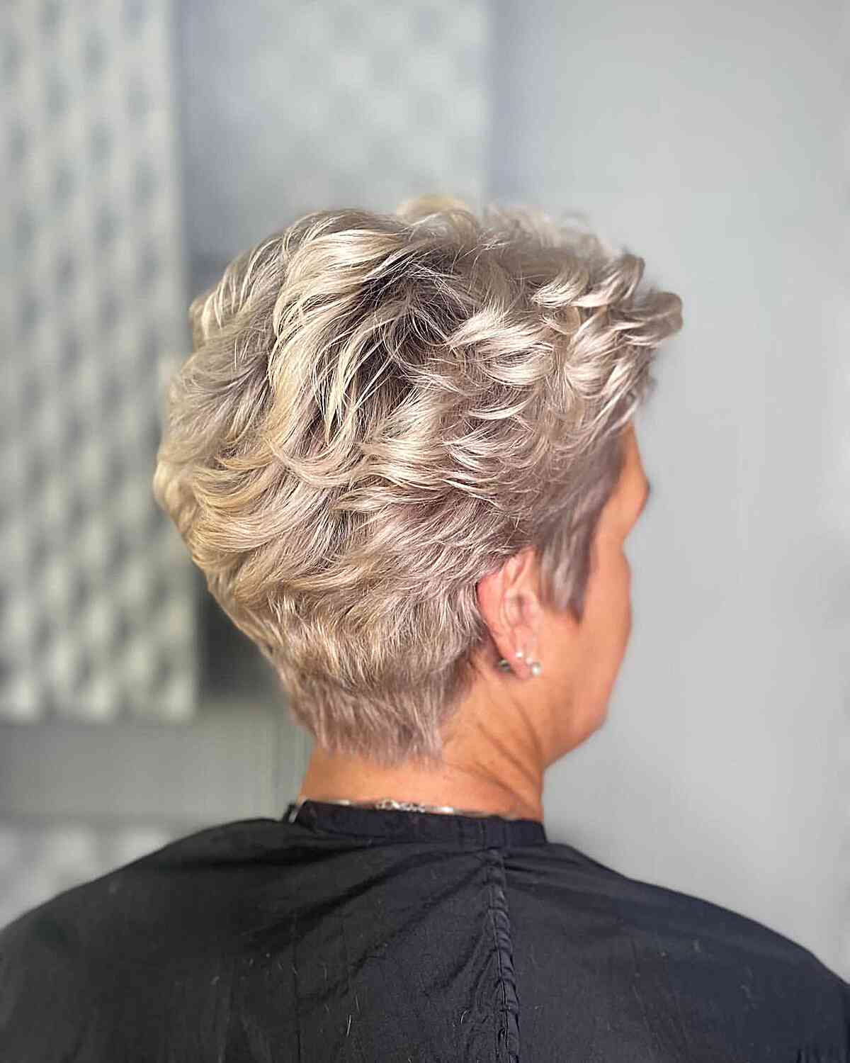 Beige Blonde Feathered Pixie with Short Layers and Tapered Nape