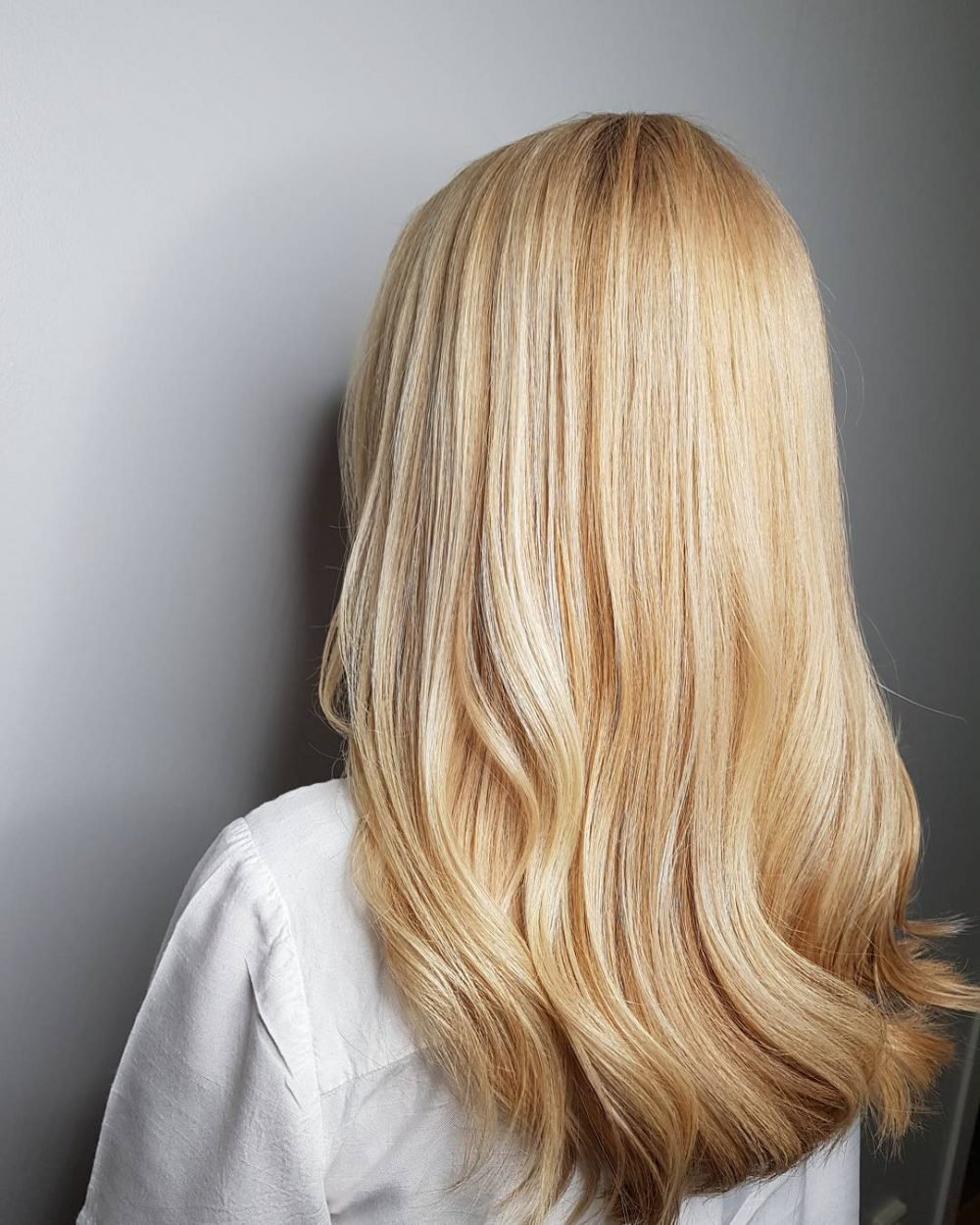 Bright honey blonde hair color