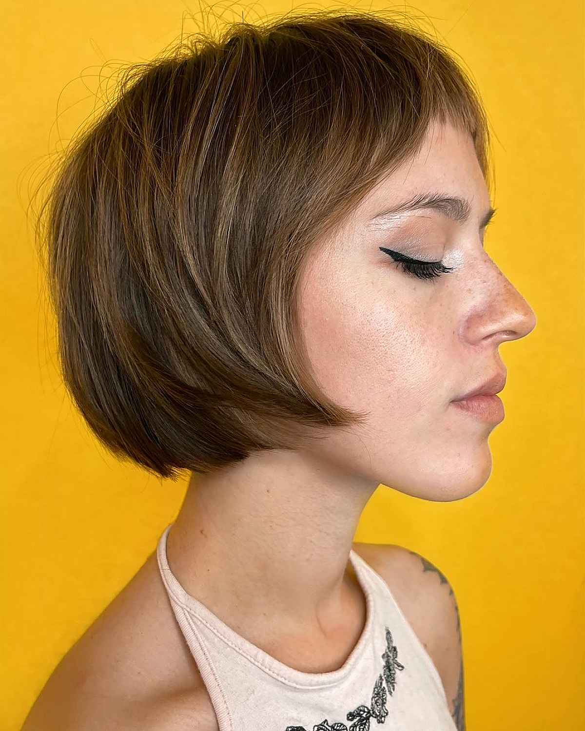 brown short bob with micro bangs