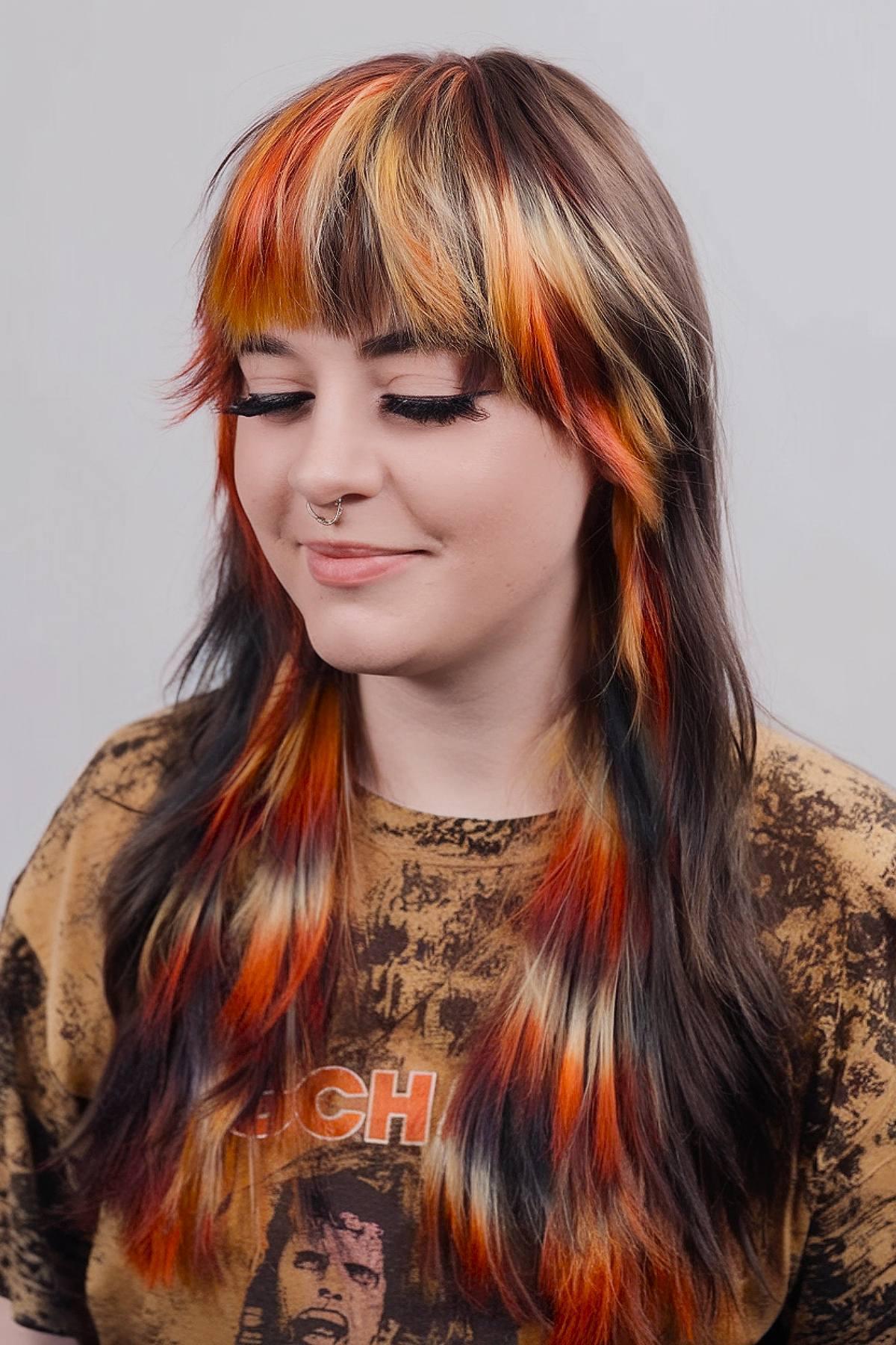 Calico hair color with raccoon tail effect in red, orange, and blonde