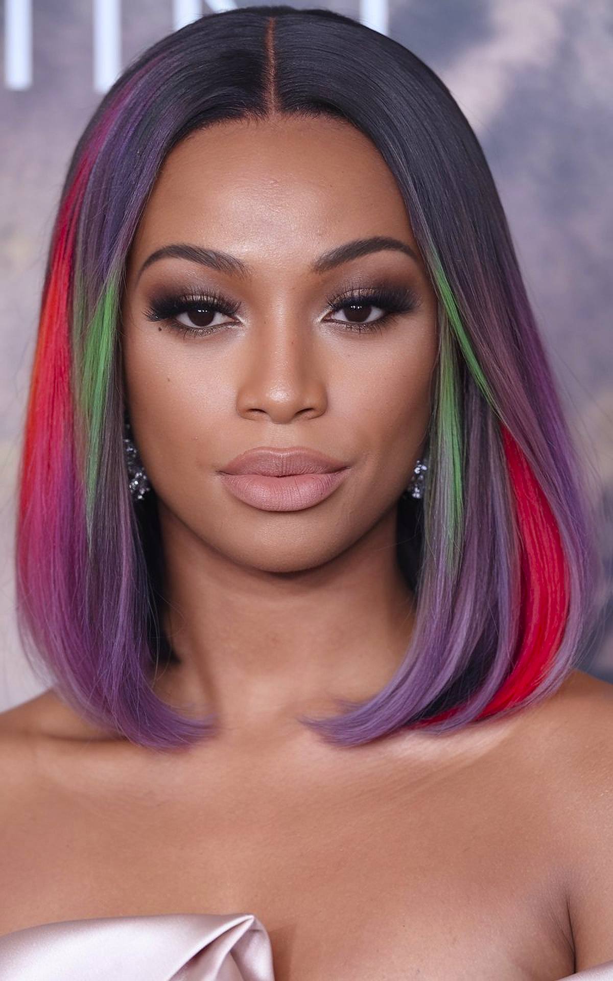 Christmas hair color idea for Black women with red, green, and purple bob