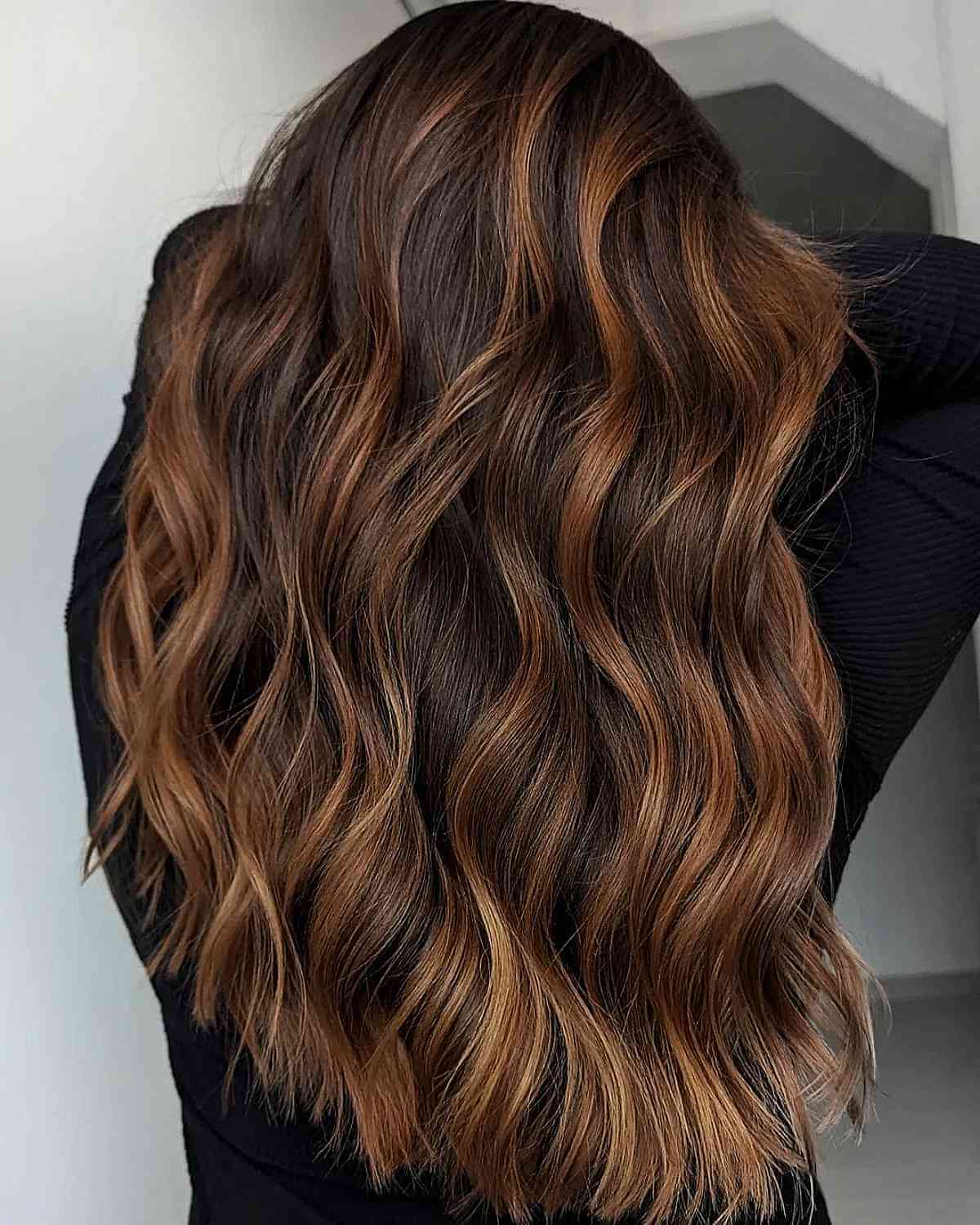 Copper highlights on dark brown hair