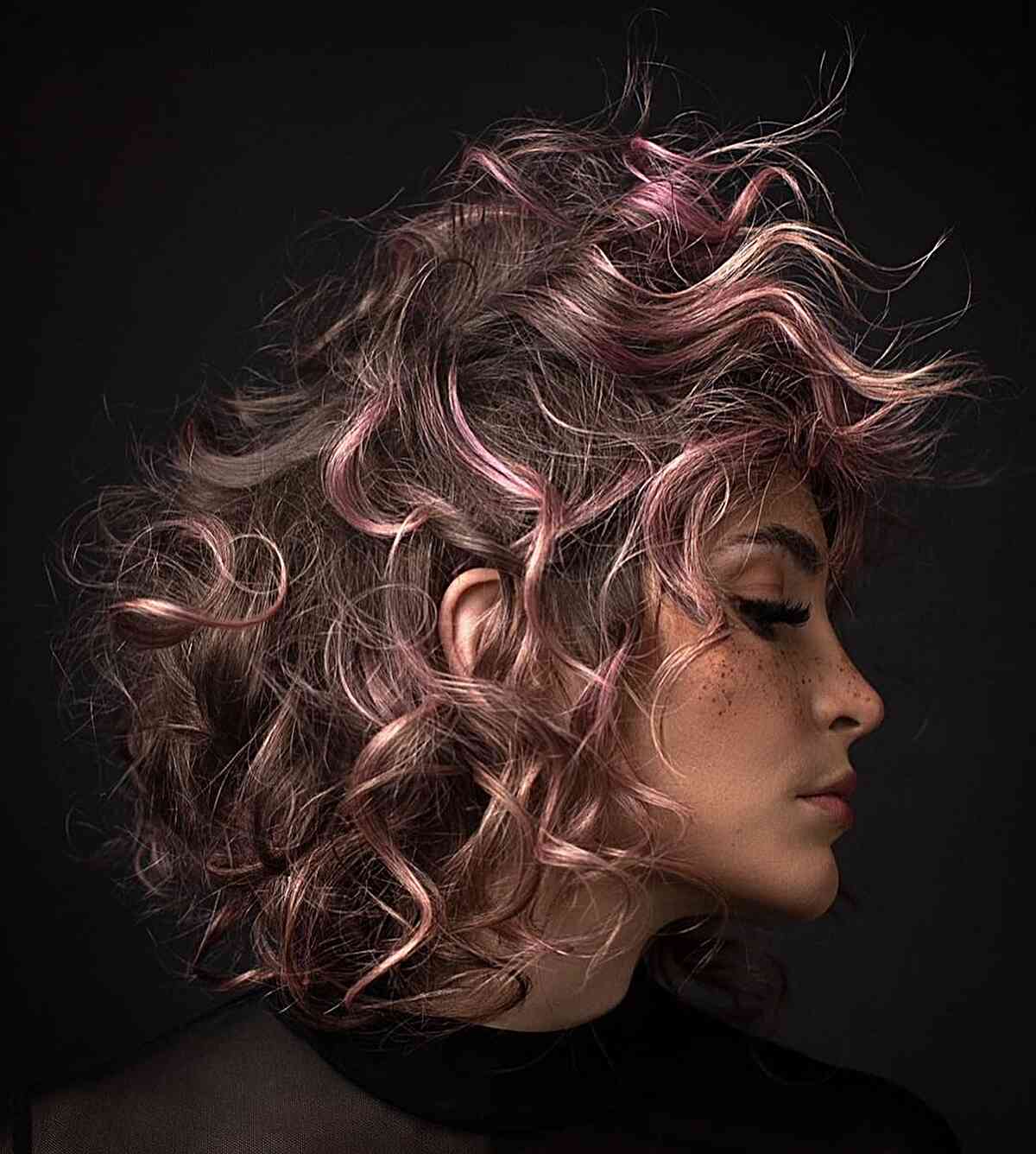 Fluffy Brunette Hair with Pink Highlights for women with a messy hairdo