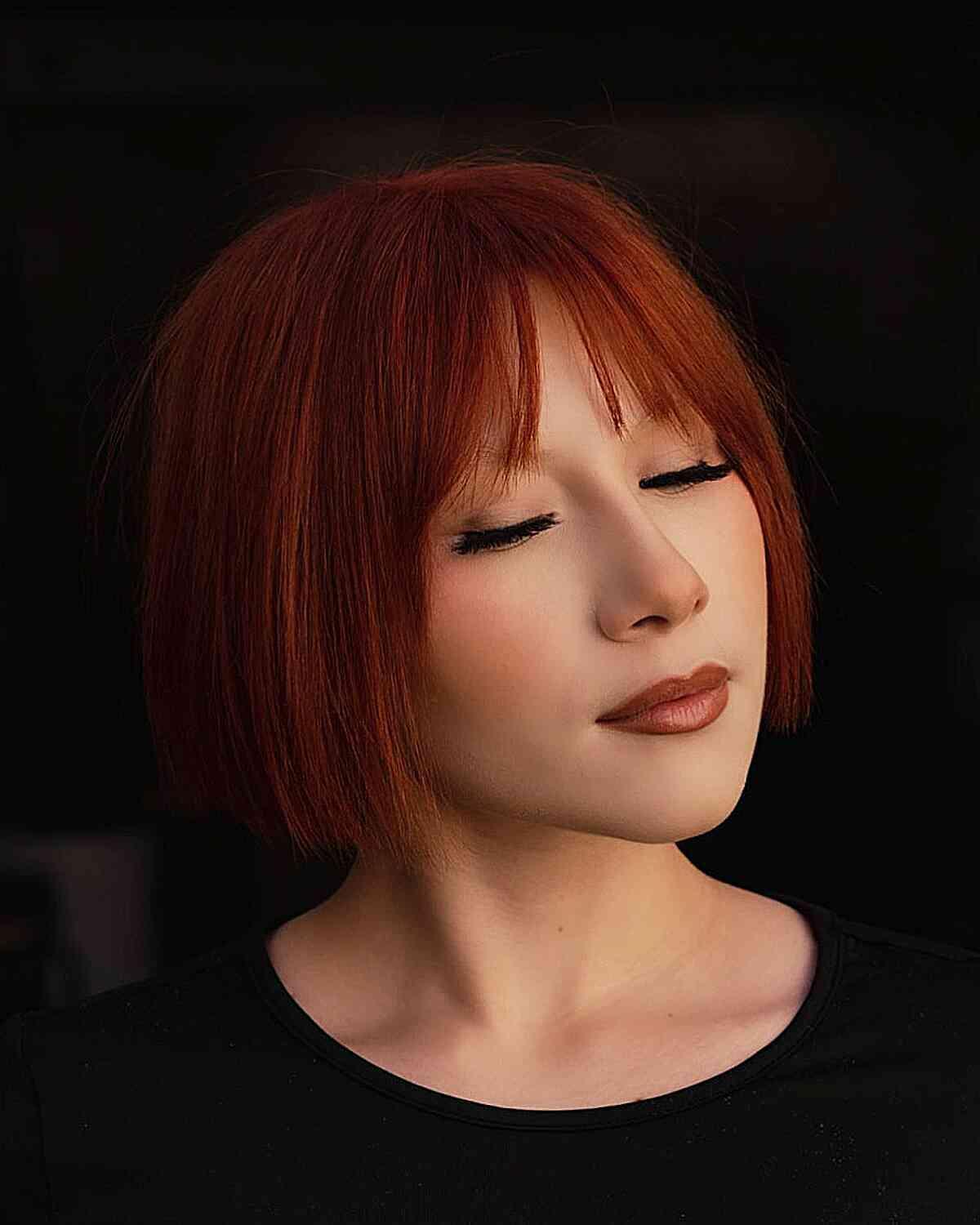 Jaw-Length Red Bob with Wispy Bangs for women with fine hair