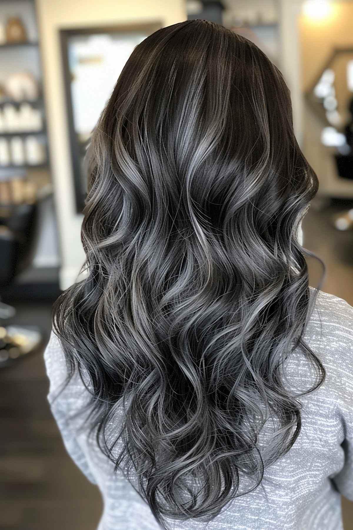 Long wavy hair with silver highlights