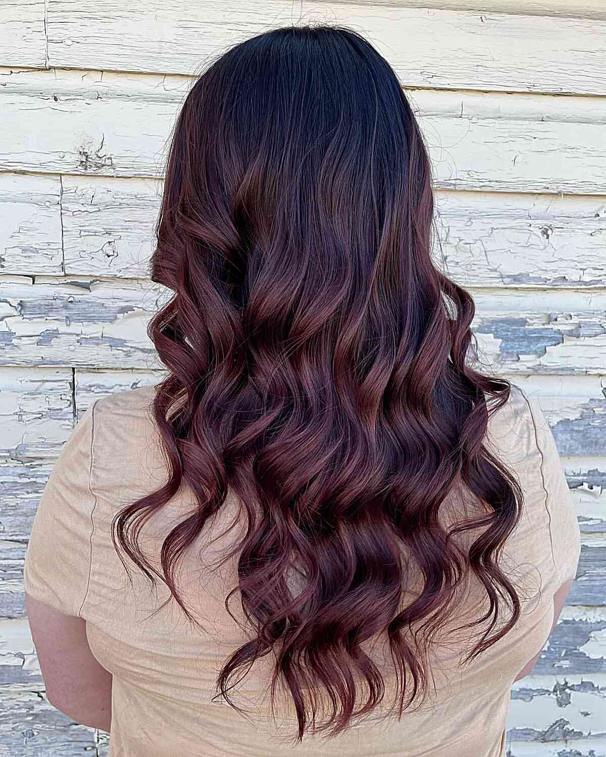 Mid-Back Loose Curls with Mahogany and Burgundy Balayage Tones