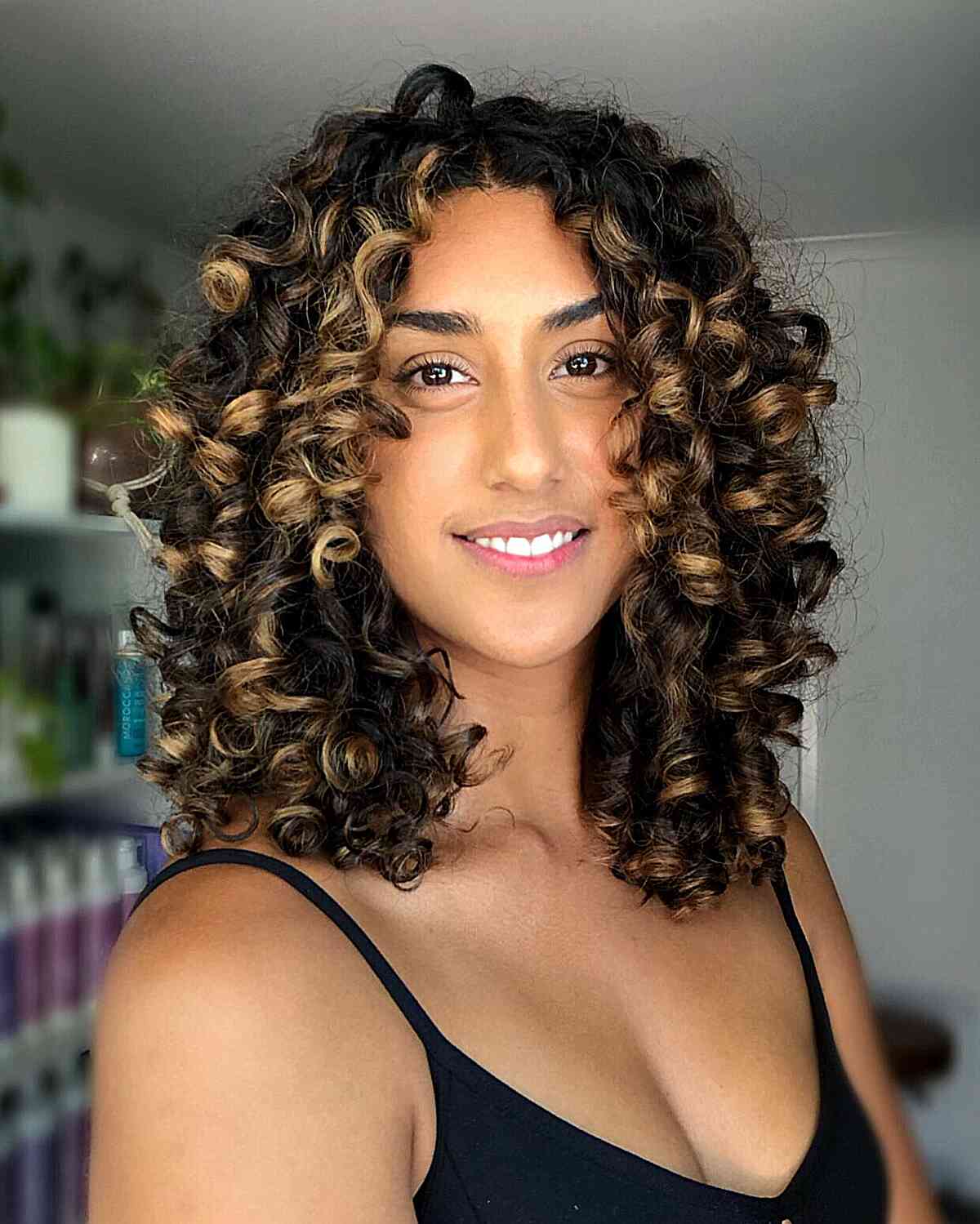 Mid-Length Layered Curly Cut with Chunky Blonde Balayage