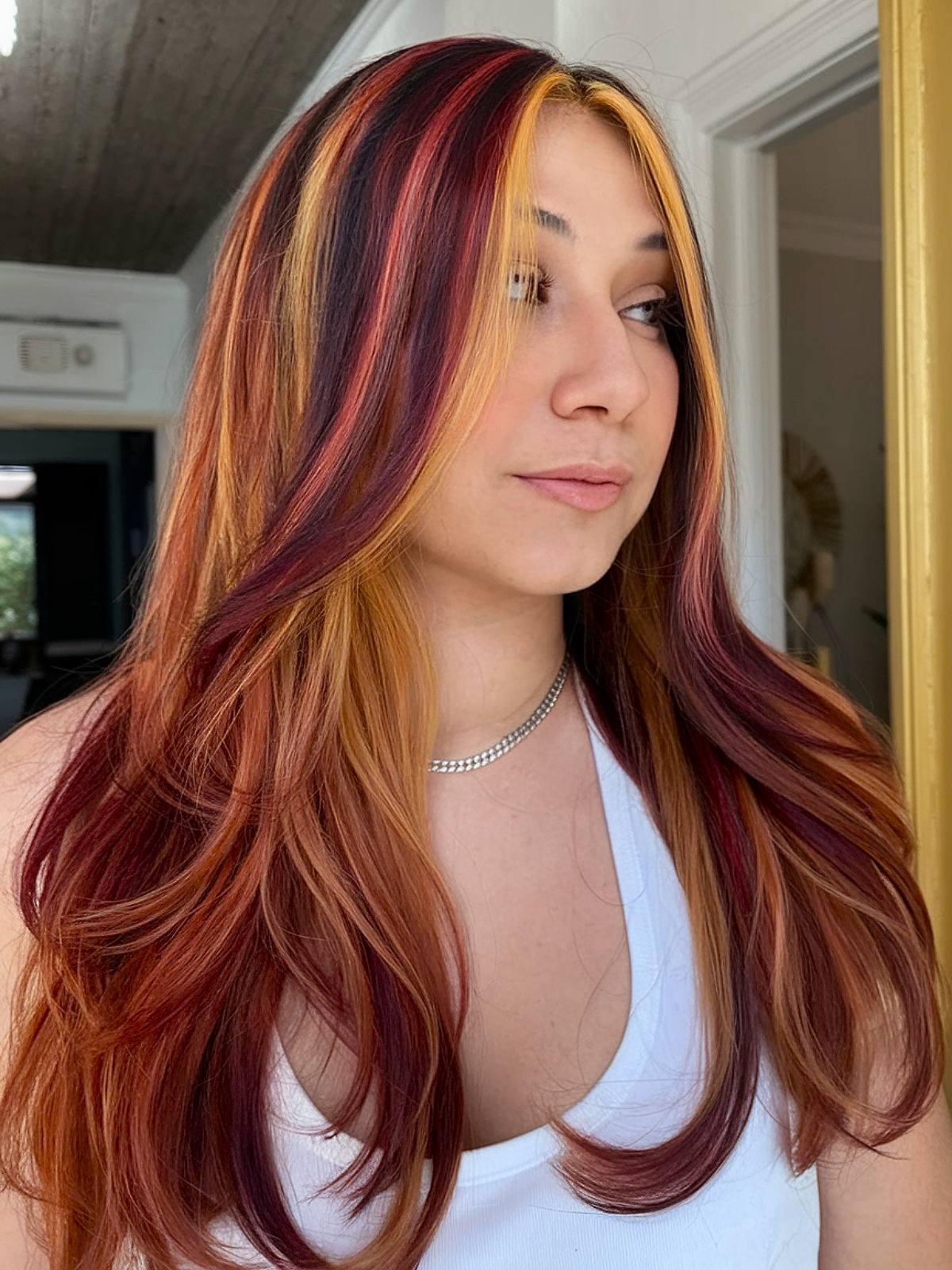 Red and blonde calico hair color with brown base