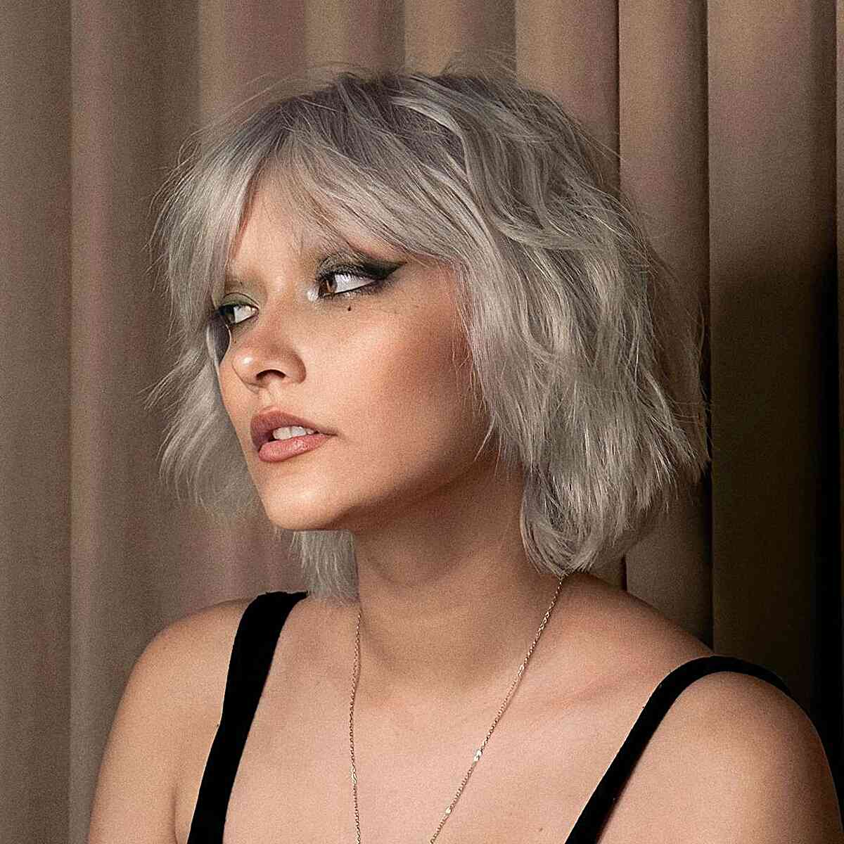 Short Ashy Blonde Tousled Bob with Curtain Fringe