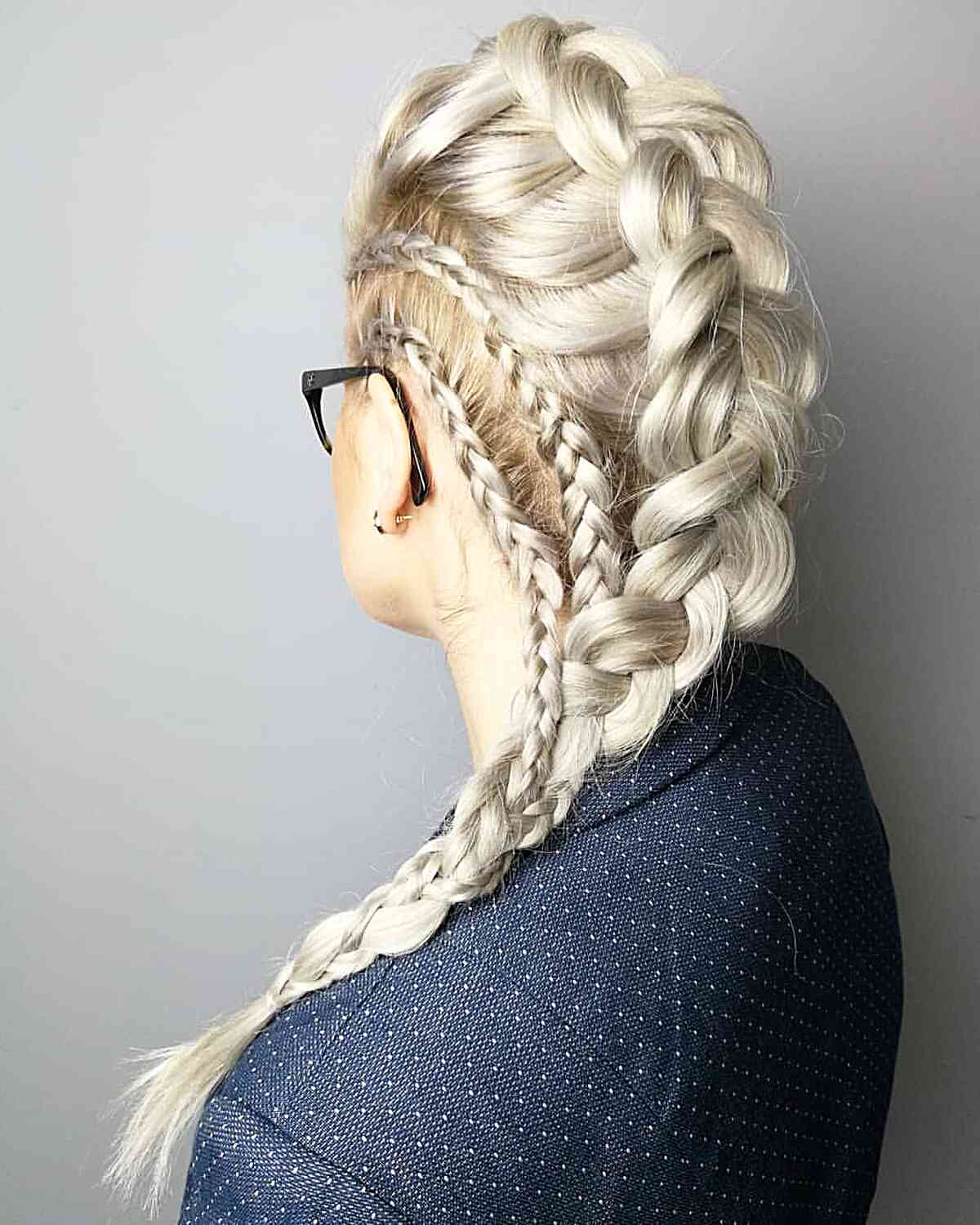 Silvery blonde straight hair in a braid