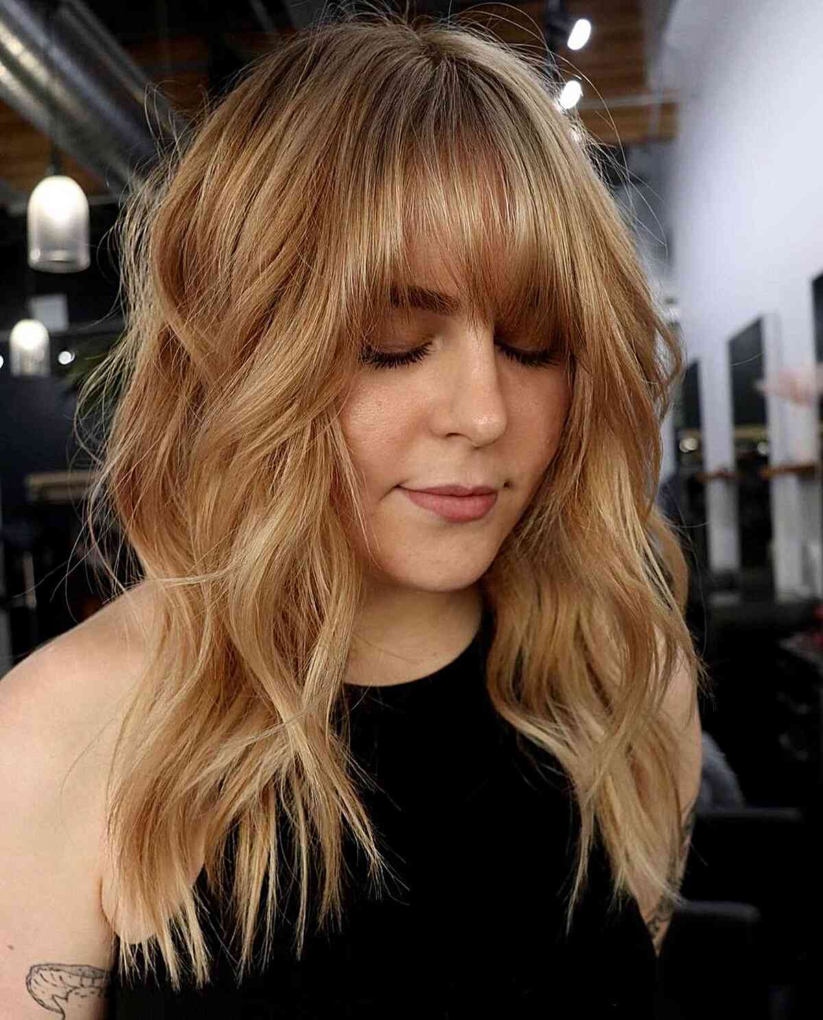 Soft Golden Balayage for Mid-length Choppy Wavy Hair with Bangs