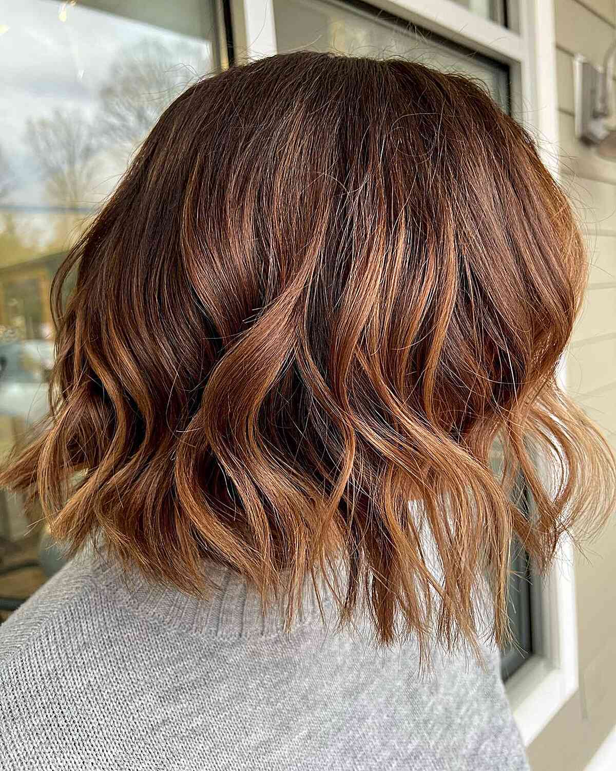 Subtle Balayage for a Short Caramel Brown Bob with Choppy Ends