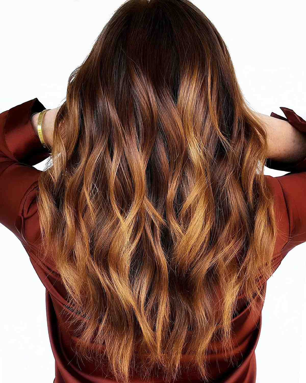 sun-kissed caramel balayage on dark brown hair