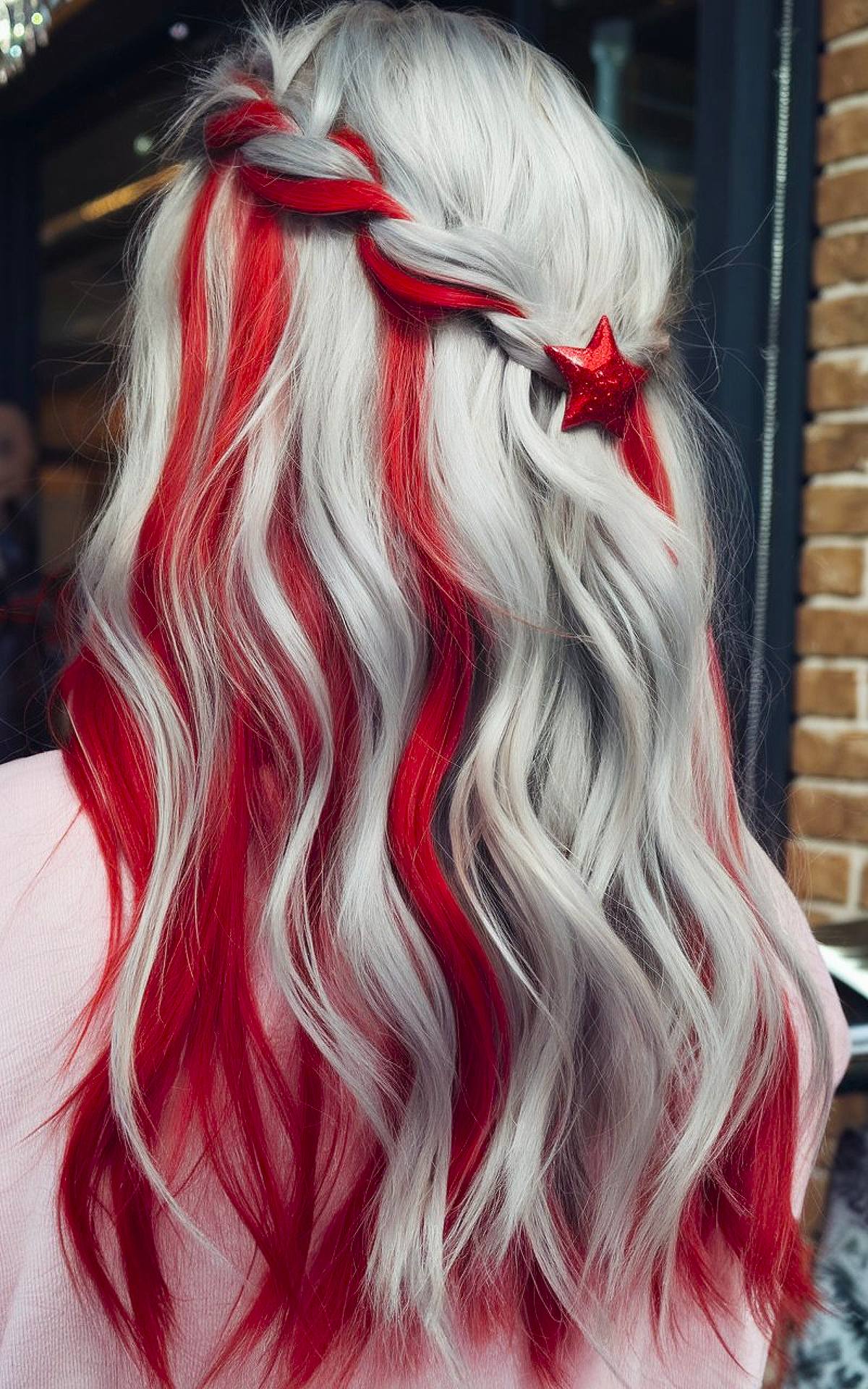 Two-color Christmas hair idea with platinum waves and red highlights