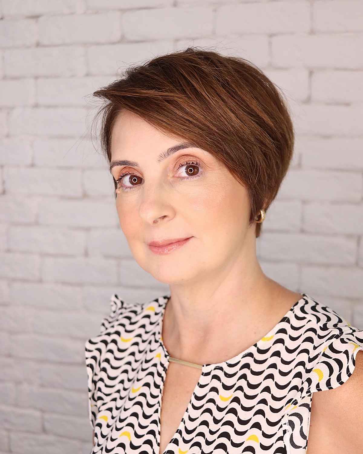 very short medium brown pixie cut