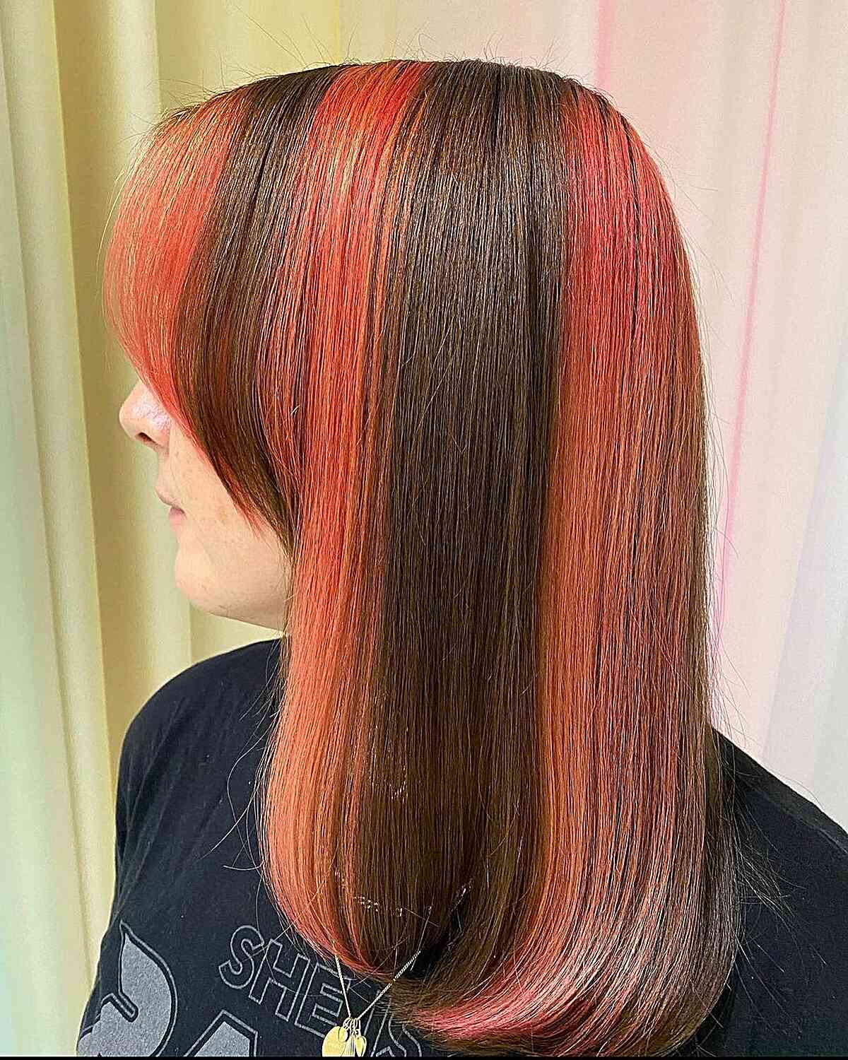 Vivid Peach Skunk Striped Color on Collarbone-Length Brunette Hair with Fringe