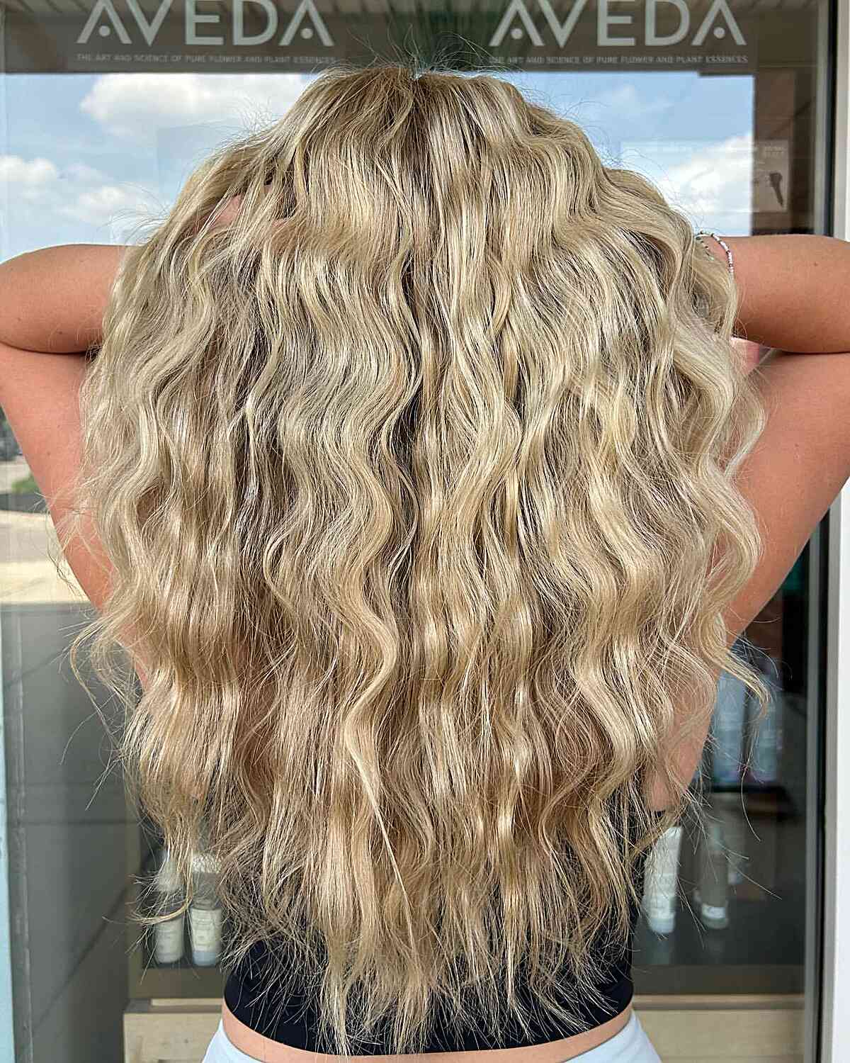 Waist-Length Blonde Beach Curls Inspired by 80s Look